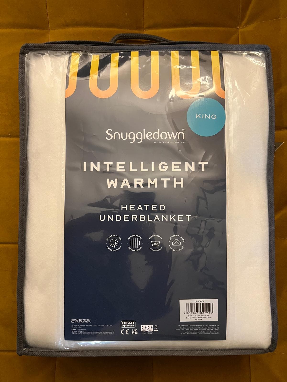 Original stock photograph of the standard Snuggledown Intelligent Warmth King heated underblanket in its navy retail bag.